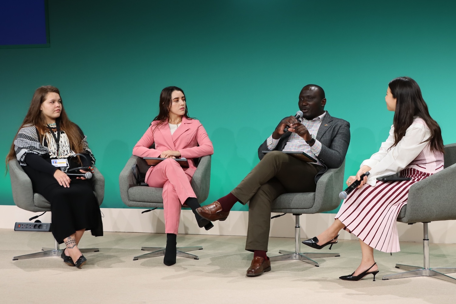 founder of YNA Kenya - maker of electric motorcycles - accepts award at COP28 climate talks 
